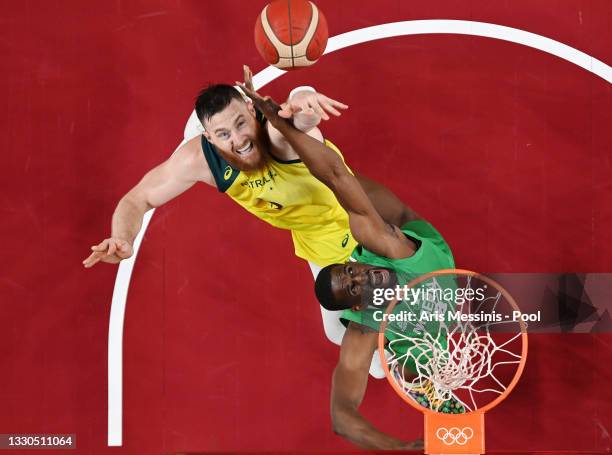 Aron Baynes of Team Australia and Ekpe Udoh of Team Nigeria battle for possession of a rebound in the first half of their Men's Preliminary Round...