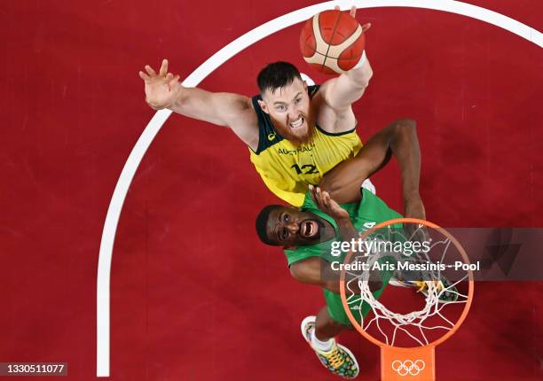 Aron Baynes of Team Australia and Ekpe Udoh of Team Nigeria battle for possession of a rebound in the first half of their Men's Preliminary Round...