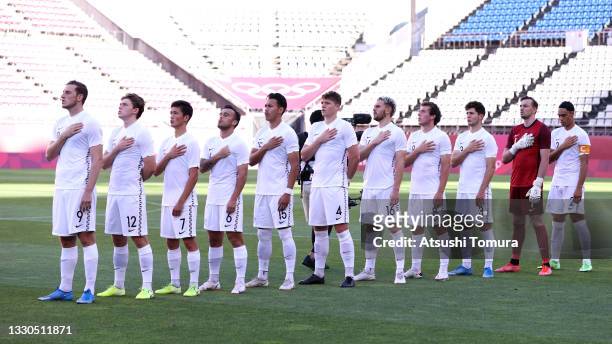 Players of Team New Zealand stand for the national anthem prior to the Men's First Round Group B match between New Zealand and Honduras on day two of...