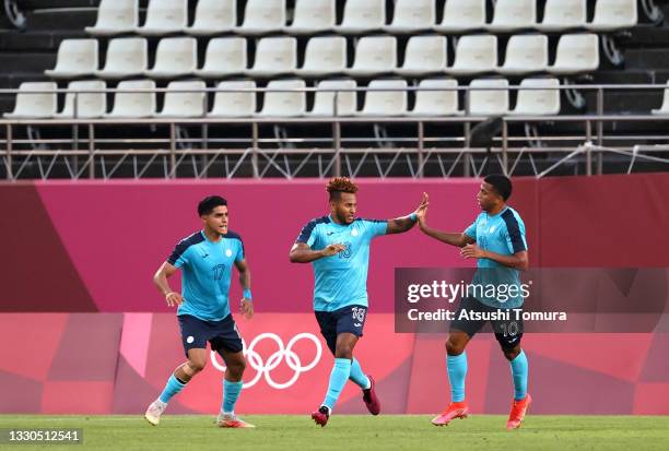 Juan Obregon of Team Honduras celebrates with teammates Luis Palma and Rigoberto Rivas after scoring their side's second goal during the Men's First...