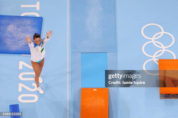 Oksana Chusovitina of Team Uzbekistan waves after competing on vault during Women's Qualification on day two of the Tokyo 2020 Olympic Games at...