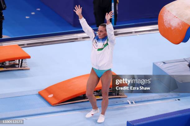 Oksana Chusovitina of Team Uzbekistan waves after competing on vault during Women's Qualification on day two of the Tokyo 2020 Olympic Games at...