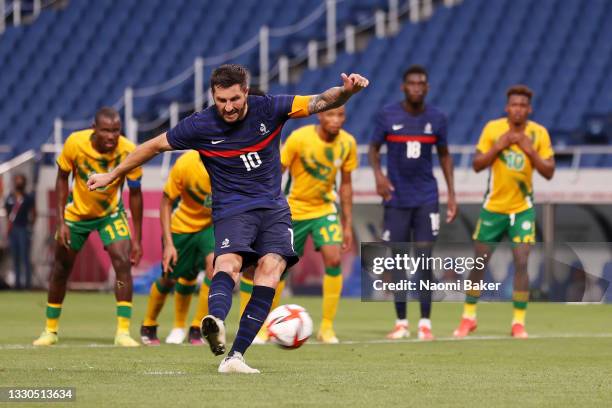 Andre-Pierre Gignac of Team France scores their side's third goal from the penalty spot during the Men's First Round Group A match between France and...