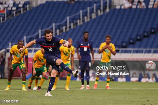 Andre-Pierre Gignac of Team France scores their side's third goal from the penalty spot during the Men's First Round Group A match between France and...
