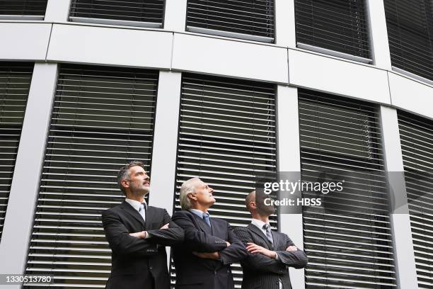 three businessmen outside building looking up - 3 men looking up stock pictures, royalty-free photos & images