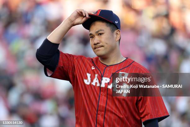 Starting pitcher Masahiro Tanaka of Samurai Japan reacts after the 1st inning during the practice game between Samurai Japan and Yomiuri Giants at...