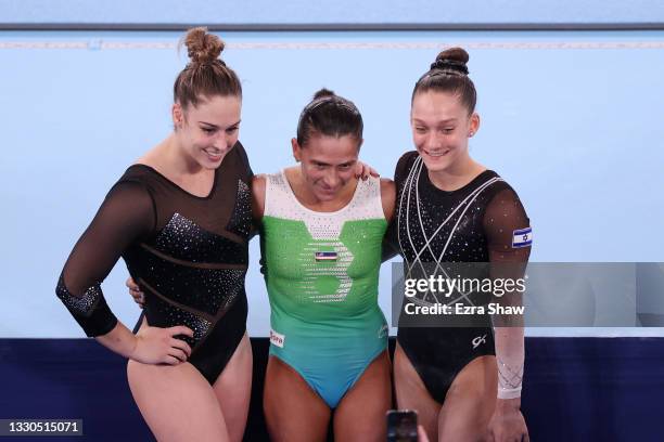 Giulia Steingruber of Team Switzerland, Oksana Chusovitina of Team Uzbekistan, and Lihie Raz of Team Israel pose for a photo during Women's...