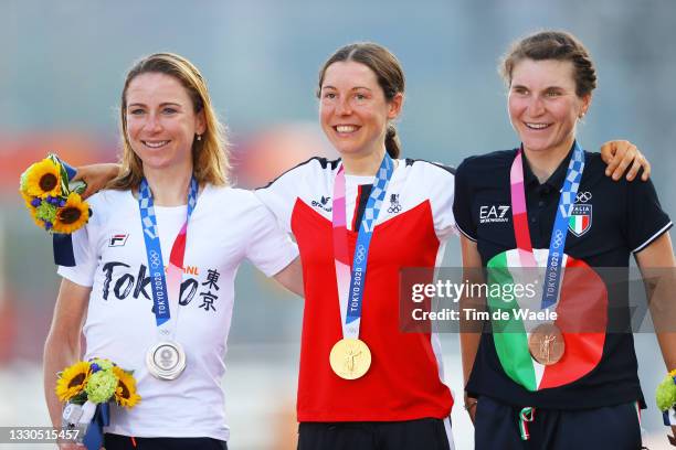 Silver medalist Annemiek van Vleuten of Team Netherlands, gold medalist Anna Kiesenhofer of Team Austria, and bronze medalist Elisa Longo Borghini of...