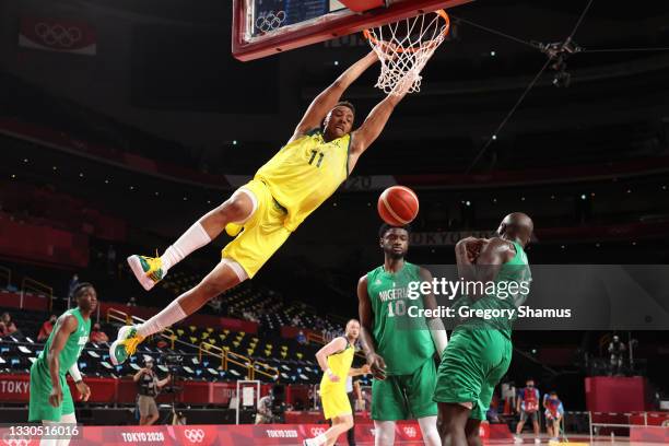 Dante Exum of Team Australia dunks against Team Nigeria during the first half of the Men's Preliminary Round Group B game on day two of the Tokyo...