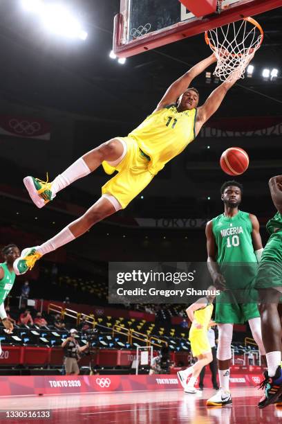 Dante Exum of Team Australia dunks against Team Nigeria during the first half of the Men's Preliminary Round Group B game on day two of the Tokyo...