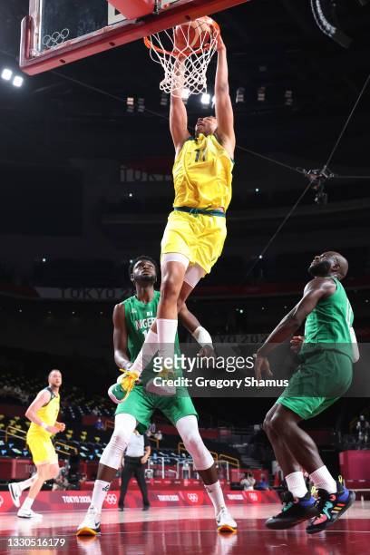 Dante Exum of Team Australia dunks against Team Nigeria during the first half of the Men's Preliminary Round Group B game on day two of the Tokyo...