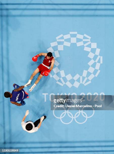 Wessam Salamana of Refugee Olympic Team is knocked down by Wanderson de Oliveira of Brazil during the Men's Light on day two of the Tokyo 2020...