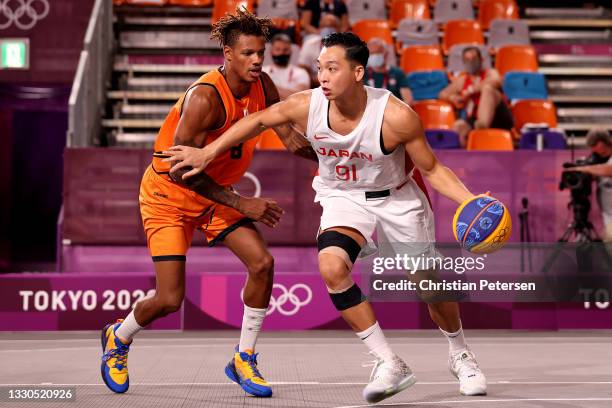 Tomoya Ochiai of Team Japan is challenged by Jessey Voorn of Team Netherlands during the Men's Pool Round match between Japan and Netherlands on day...