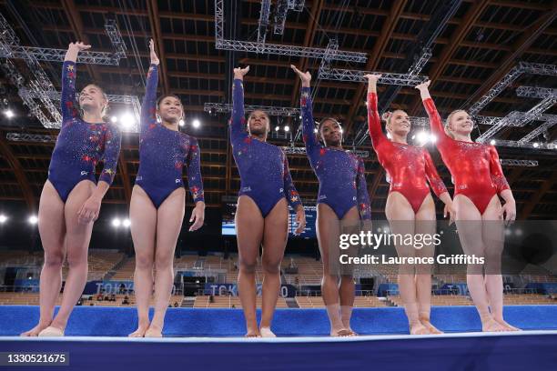 Grace McCullum, Sunisa Lee, Jordan Chiles, Simone Biles, Mykayla Skinner and Jade Carey of Team USA wave as they line up ahead of their floor...