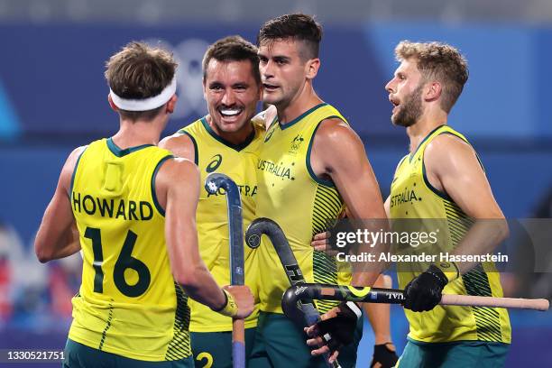 Blake Govers of Team Australia celebrates with teammates after scoring their team's sixth goal during the Men's Preliminary Pool A match between...