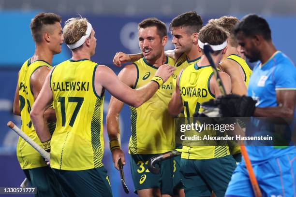 Blake Govers of Team Australia celebrates with teammates after scoring their team's sixth goal during the Men's Preliminary Pool A match between...