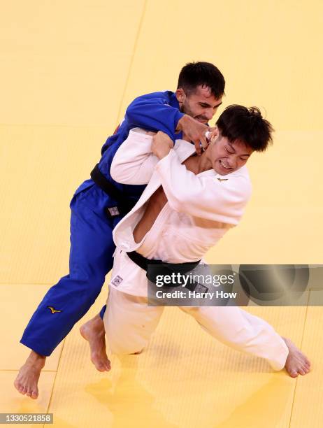 Hifumi Abe of Team Japan and Vazha Margvelashvili of Team Georgia compete during the Men’s Judo 66kg Final on day two of the Tokyo 2020 Olympic Games...