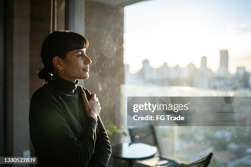 Young woman contemplating at home Young woman contemplating at home