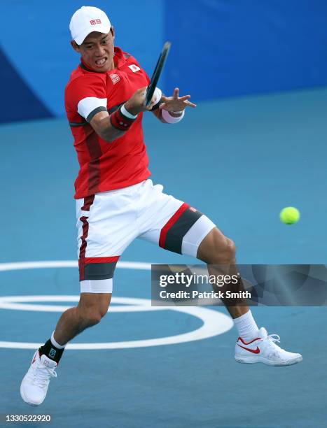 Kei Nishikori of Team Japan plays a forehand during his Men's Singles First Round match against Andrey Rublev of Team ROC on day two of the Tokyo...