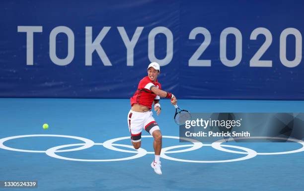 Kei Nishikori of Team Japan plays a forehand during his Men's Singles First Round match against Andrey Rublev of Team ROC on day two of the Tokyo...