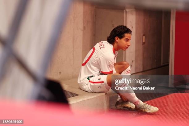 Diego Lainez of Team Mexico prepares his boots in the tunnel prior to the Men's First Round Group A match between Japan and Mexico on day two of the...