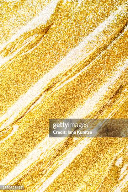 golden smudged texture of paint, nail polish. cosmetic products. makeup. copy space. vertical beauty banner. - gel pack stock pictures, royalty-free photos & images