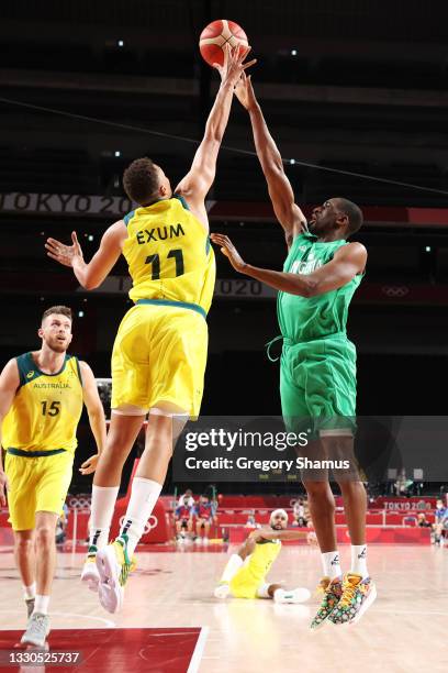 Ekpe Udoh of Team Nigeria takes a shot over Dante Exum of Team Australia in the second half of the Men's Preliminary Round Group B game on day two of...