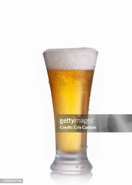 beer glass on white background - lager stock pictures, royalty-free photos & images
