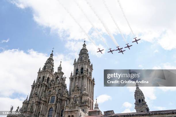 Military airplanes fly over the sky near Santiago Cathedral during the national offering to the apostle Santiago on Santiago's regional festivity at...