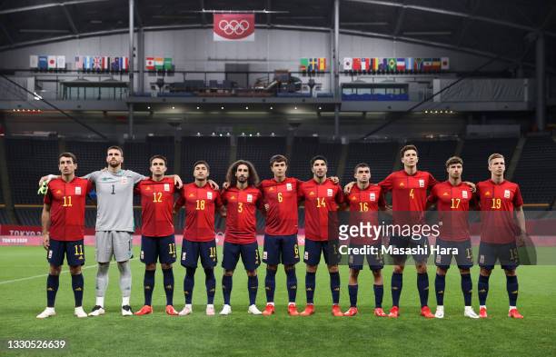 Players of Team Spain stand for the national anthem prior to the Men's First Round Group C match between Australia and Spain on day two of the Tokyo...