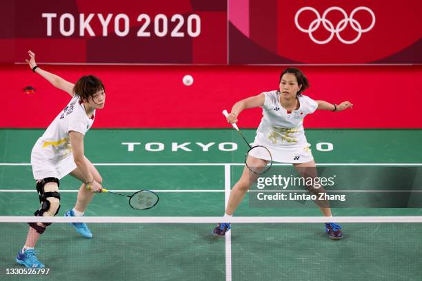 Yuki Fukushima and Sayaka Hirota of Team Japan compete against Chow Mei Kuan and Lee Meng Yean of Team Malaysia during a Women's Doubles Group A...