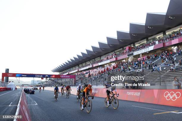 General view of Marianne Vos of Team Netherlands ahead of Lisa Brennauer of Team Germany cross the finish line during the Women's road race on day...