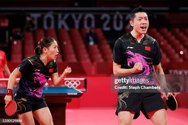 Liu Shiwen and Xu Xin of Team China react during their Mixed Doubles Semifinal match on day two of the Tokyo 2020 Olympic Games at Tokyo Metropolitan...