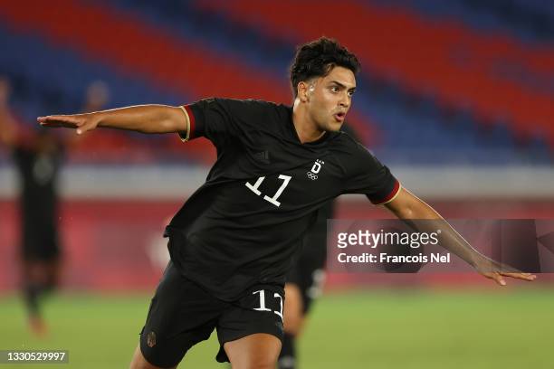 Nadiem Amiri of Team Germany celebrates after scoring their side's first goal during the Men's First Round Group D match between Saudi Arabia and...