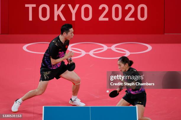 Liu Shiwen and Xu Xin of Team China in action during their Mixed Doubles Semifinal match on day two of the Tokyo 2020 Olympic Games at Tokyo...