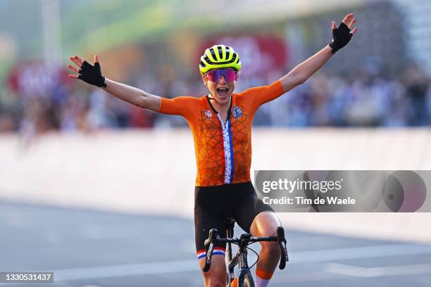 Annemiek van Vleuten of Team Netherlands celebrates crosses the finishing line winning the silver medal on day two of the Tokyo 2020 Olympic Games at...