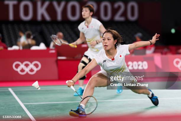 Yuki Fukushima and Sayaka Hirota of Team Japan compete against Chow Mei Kuan and Lee Meng Yean of Team Malaysia during a Women's Doubles Group A...