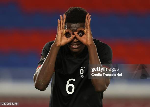 Ragnar Ache of Team Germany celebrates after scoring their side's second goal during the Men's First Round Group D match between Saudi Arabia and...