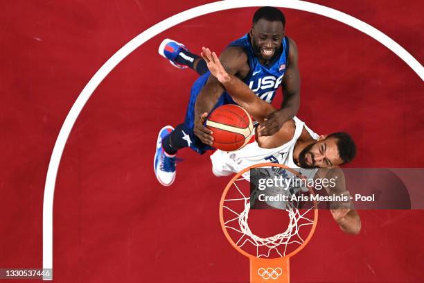 Draymond Green of Team United States and Rudy Gobert of Team France battle for possesion of the ball during the first half of the Men's Preliminary...