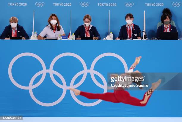 Judges look on as Pauline Schaefer-Betz of Team Germany competes in the floor exercise during Women's Qualification on day two of the Tokyo 2020...