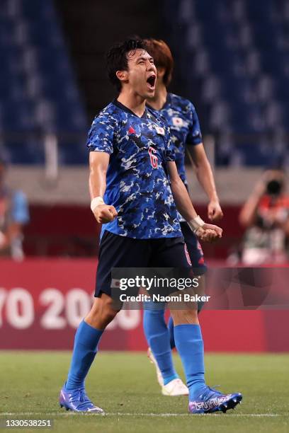 Wataru Endo of Team Japan celebrates their side's victory after the Men's First Round Group A match between Japan and Mexico on day two of the Tokyo...
