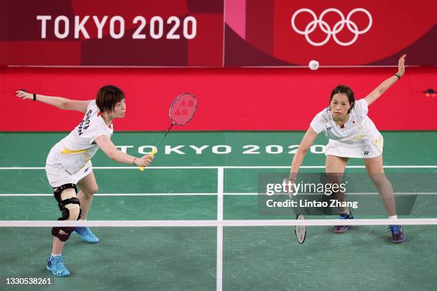 Yuki Fukushima and Sayaka Hirota of Team Japan compete against Chow Mei Kuan and Lee Meng Yean of Team Malaysia during a Women's Doubles Group A...