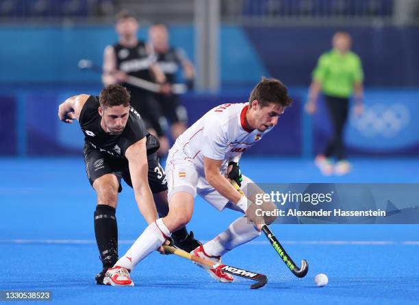 Nick Wilson of Team New Zealand attempts to tackle Josep Romeu Argemi of Team Spain during the Men's Preliminary Pool A match between Spain and New...