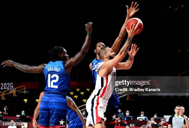 Evan Fournier of France attempts to break through the defence during the preliminary rounds of the Men's Basketball match between the USA and France...