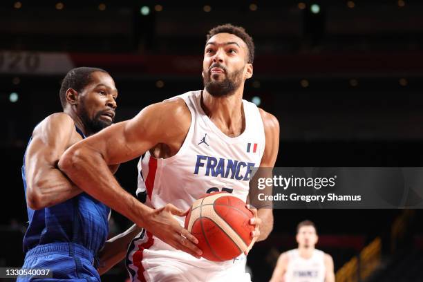 Rudy Gobert of Team France drives past Kevin Durant of Team United States during the first half of the Men's Preliminary Round Group B game on day...