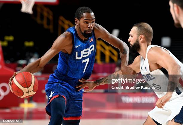 Kevin Durant of the USA takes on the defence of Evan Fournier of France during the preliminary rounds of the Men's Basketball match between the USA...