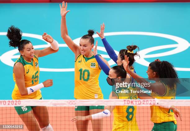 Gabriela Braga Guimaraes of Team Brazil reacts with team mates against Team South Korea during the Women's Preliminary - Pool A on day two of the...