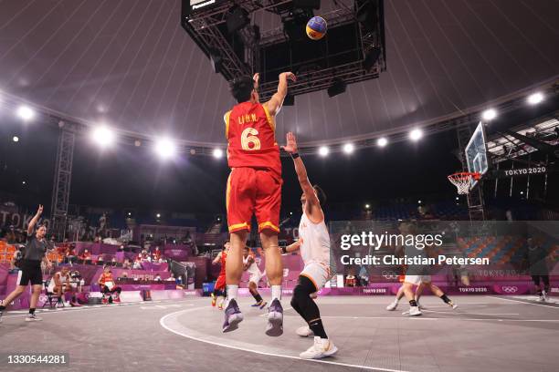 Haonan Li of Team China shoots during the Men's Pool Round match between Netherlands and China on day two of the Tokyo 2020 Olympic Games at Aomi...