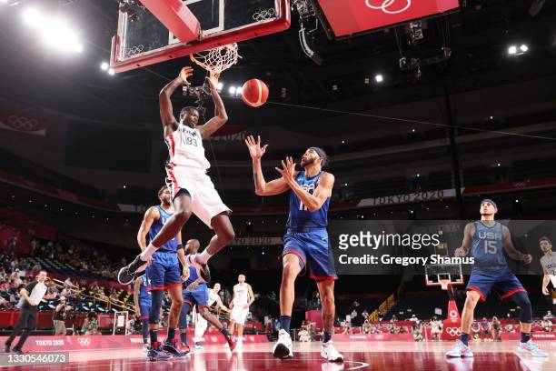 Moustapha Fall of Team France dunks the ball over JaVale McGee of Team United States during the second half of the Men's Preliminary Round Group B...