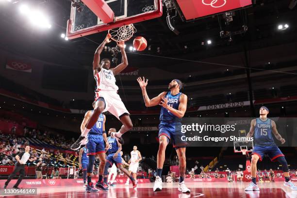 Moustapha Fall of Team France dunks the ball over JaVale McGee of Team United States during the second half of the Men's Preliminary Round Group B...